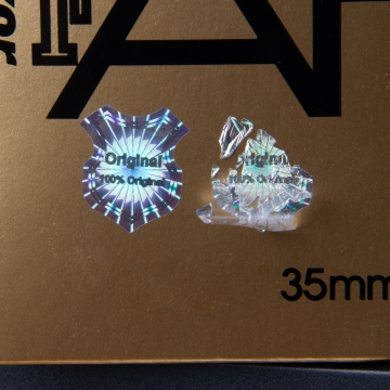 Original silver security sticker, 23 x 20 mm, Shield